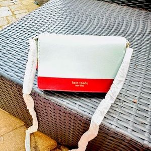 Kate spade small cross body bag light blue with brown brand new!